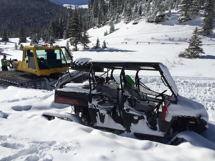 Field mechanical recovery — Bombardier snowcat and UTV in mountain terrain, Colorado